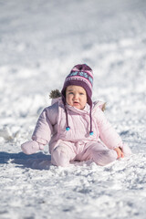 Fototapeta na wymiar Portrait of baby in the snow in winter