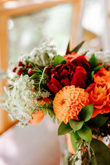 Summer orange and red wedding florals
