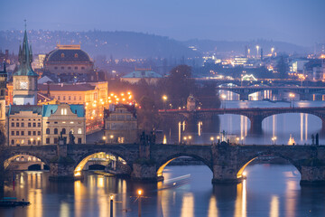 Fototapeta na wymiar Evening in Prague with Vltava River and bridges