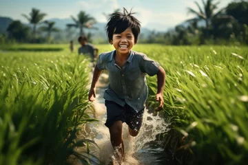Foto op Canvas Asian child runs in the paddy field. Generative AI. © visoot