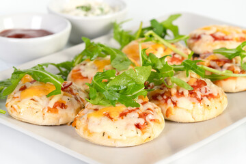 Mini pizza party snacks on a plate