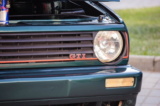 front of the VW golf GTI car with headlight and radiator grille