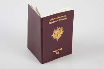 open French biometric passport close-up on white background