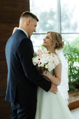 meeting of the bride and groom in the hotel lobby