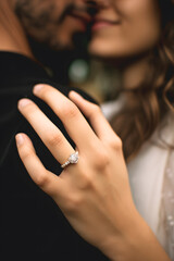 The hands that embrace men and women and the wedding ring on the ring finger