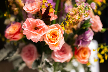 Bunch of colorful pink rose flowers  that arranged with other flower. Close-up and selective focus.