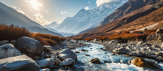 Himalaya mountains and stream water from melted glacier view from Bimthang village in Manaslu circuit trekking route in Nepal Asia. Creative Banner. Copyspace image