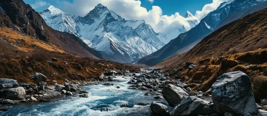 Photo sur Plexiglas Manaslu Himalaya mountains and stream water from melted glacier view from Bimthang village in Manaslu circuit trekking route in Nepal Asia. Creative Banner. Copyspace image
