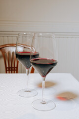 red wine  two glasses on Restaurant table old fashion chair behind