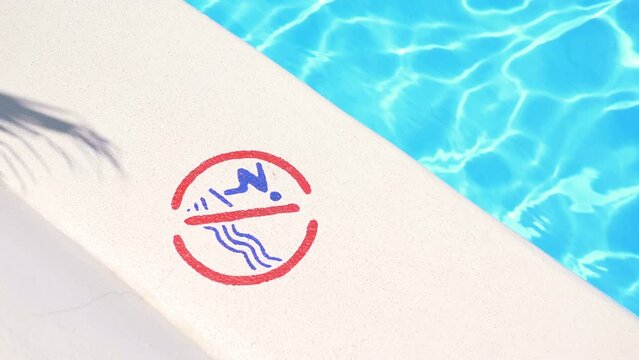 No Diving Sign Posted by the Poolside in 4k slow motion 60fps