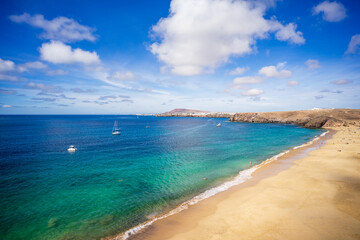 Fototapeta na wymiar Playa de Mujeres. Popular beach in Lanzarote on Playa Blanca, Canary Islands, Spain.