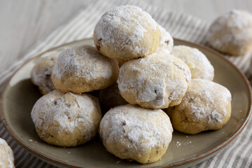 Homemade Snowball Cookies on a Plate, side view.