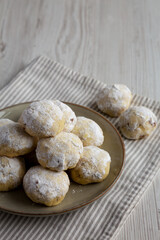 Homemade Snowball Cookies on a Plate, side view. Copy space.