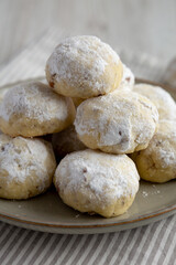 Homemade Snowball Cookies on a Plate, side view.