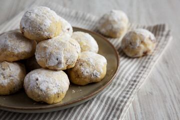 Homemade Snowball Cookies on a Plate, side view.