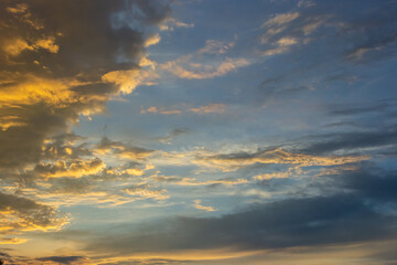 clouds in the sky illuminated by the sun summer evening. background