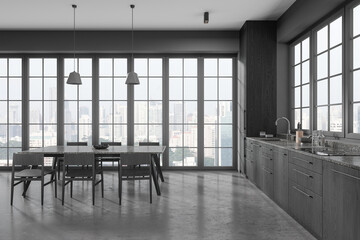 Grey home kitchen interior with cooking and eating space, panoramic window