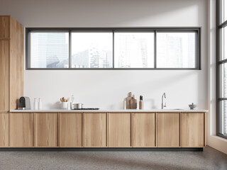 Stylish home kitchen interior with cabinet, sink and kitchenware with window