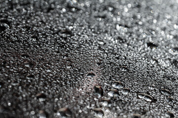 Drops of water on a color background. Selective focus. Gray