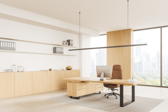 Luxury ceo workplace interior with desk near window, pc desktop and sideboard