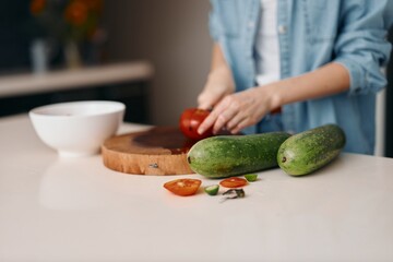 Fresh Food, Healthy Lifestyle: Woman Preparing a Green Vegetarian Salad at Home