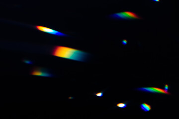 Blur colorful rainbow crystal light leaks on black background. Defocused abstract multicolored retro film lens flare bokeh analog photo overlay or screen filter effect. Glow Vintage prism colors
