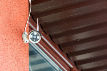 Video surveillance systems. Security systems and protection from theft. Security CCTV camera installed on the facade of a residential building. Digital technology.