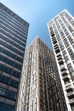 Dynamic high rise glass fronted British architecture, a business district on the south bank of the River Thames in London, capital city of the United Kingdom.