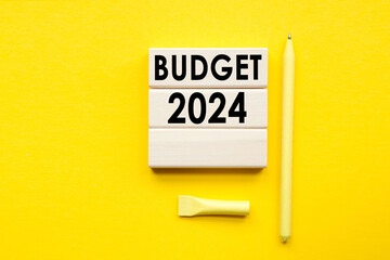 2024 Budget planning and allocation concept. yellow background, copy space. Use for banner and presentation. - obrazy, fototapety, plakaty