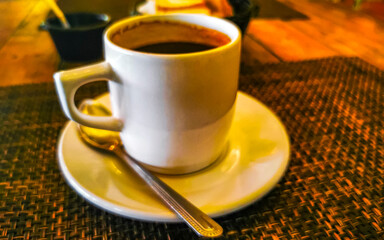 Cup of americano black coffee in restaurant cafe in Mexico.