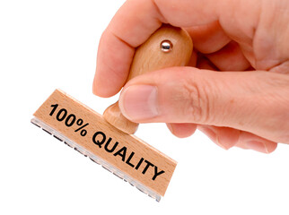 Rubber stamp in hand with the inscription 100 % quality