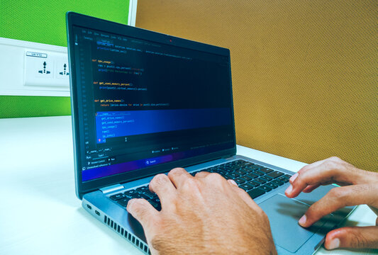 Bengaluru, India- 20th November 2023:An employee developing Python code on his laptop.