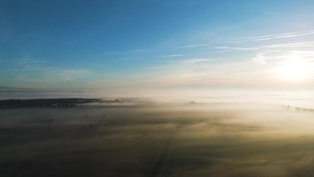 Sunrise Serenity Above Fog-Clad Fields