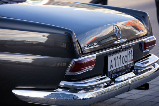 Mercedes-Benz 280 SE Coupe W111 car on city auto festival. Rear side view on trunk of classic auto