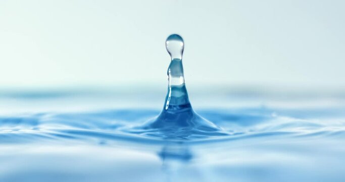 Drop close-up of water falls in a super slow motion.
