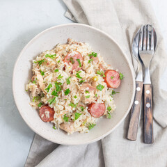 Traditional South Carolina chicken bog dish with smocked sausages, top view, square format