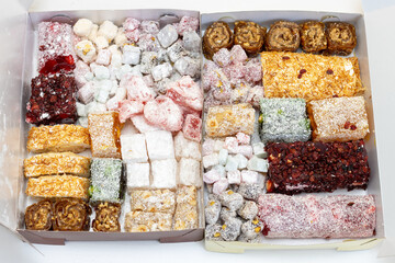 Close-up of an assortment of Turkish delight with different flavors. Oriental sweets.