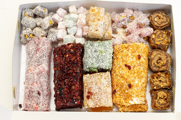 Close-up of an assortment of Turkish delight with different flavors. Oriental sweets.