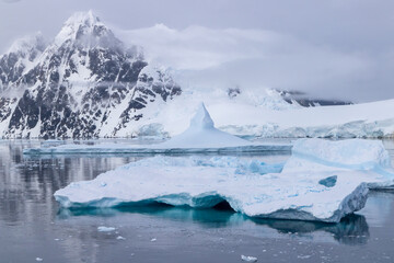Ice, snow, and moutains near the Lemaire Channel in Antartica.