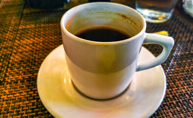 Cup of americano black coffee in restaurant cafe in Mexico.