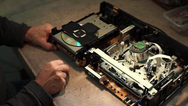 close-up of a CD player. Slow motion video. High quality 4k ft.