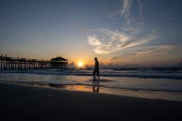 Man on a morning walk along the shore