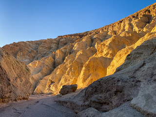Beautiful golden sunset at Golden Canyon at Death valley during winter. CA, USA