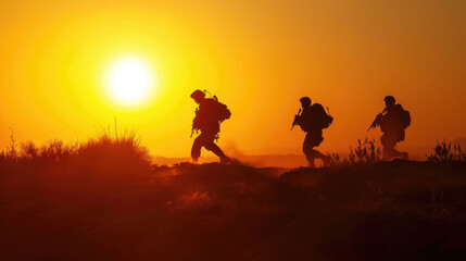 Fototapeta na wymiar A suluette of military soldiers on a mission against a background of the walking sun outdoors