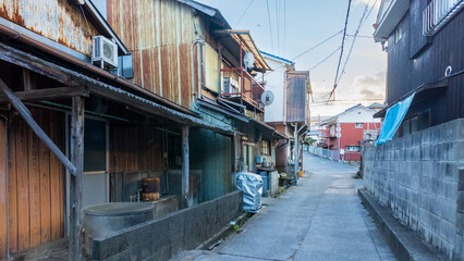 Narrow road between old houses in small town Japan - obrazy, fototapety, plakaty
