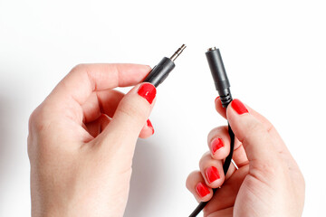 Audio jack on a girl's hand, audio jack for connection
