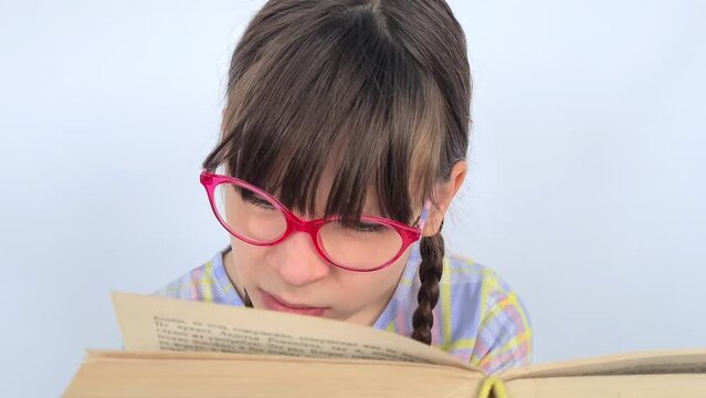 Bookworm with glasses and books poor eyesight reading too much. Vision problems in children and education - Powered by Adobe