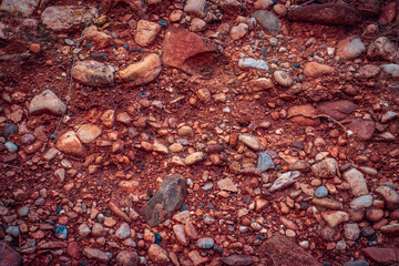 Soil with stones, clay layers photo. Slice of sand with layers of different structures.