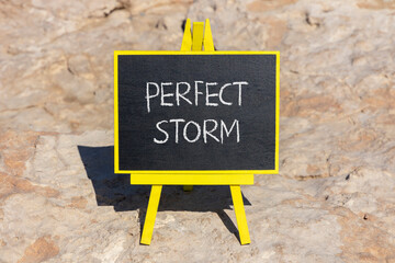 Perfect storm symbol. Concept words Perfect storm on beautiful black chalk blackboard on a beautiful stone background. Business and Perfect storm concept. Copy space.