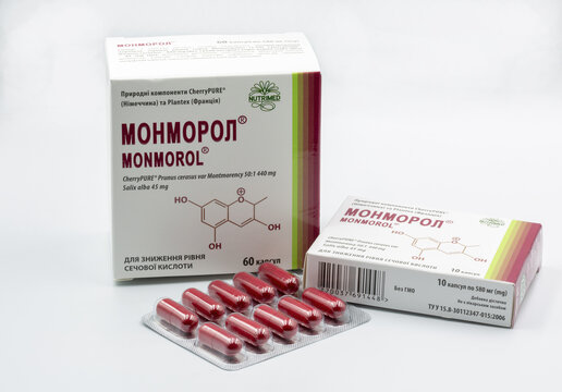 Monmorol capsules pack and blister closeup against white.